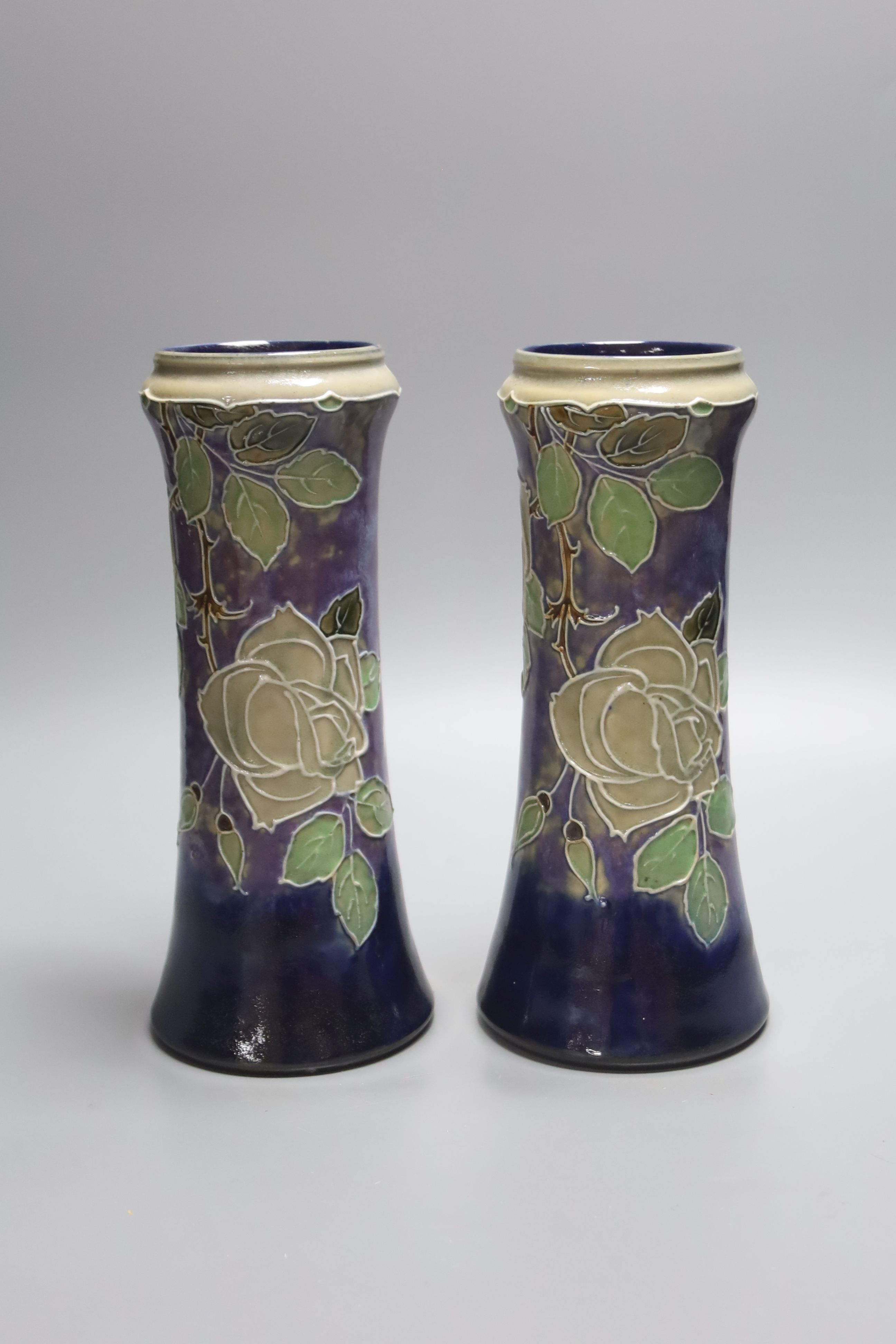 A pair of Doulton stoneware vases, height 26.5cm